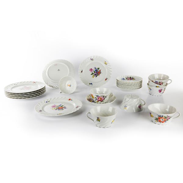 Eight teacups with saucers and eight dessert plates
