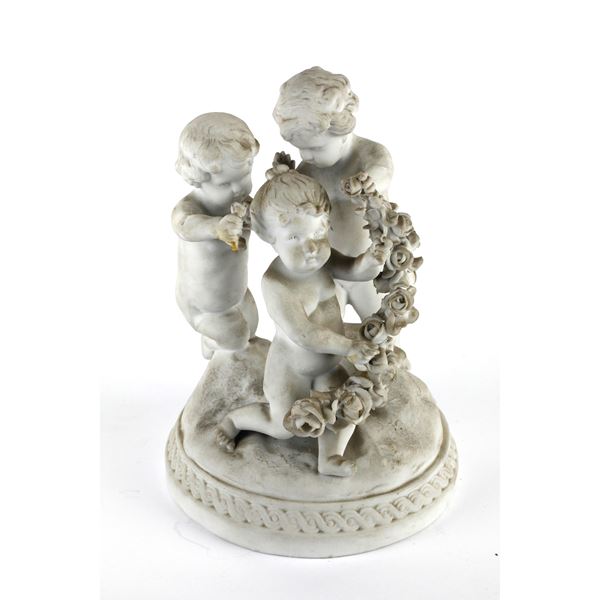 Three putti group in white porcelain