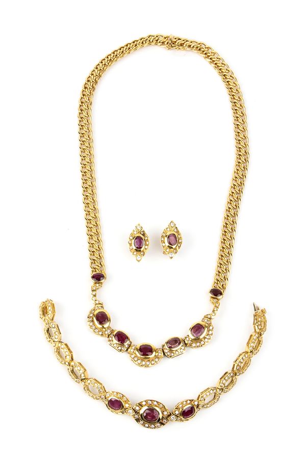 Ruby diamond gold necklace, bracelet and a pair of earrings 