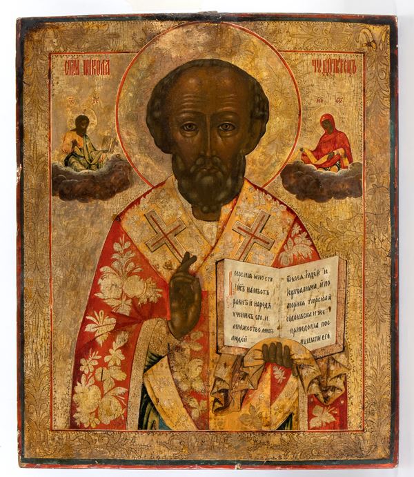 Russian icon depicting St. Nicholas the thaumaturge sided by Jesus and the Virgin. 