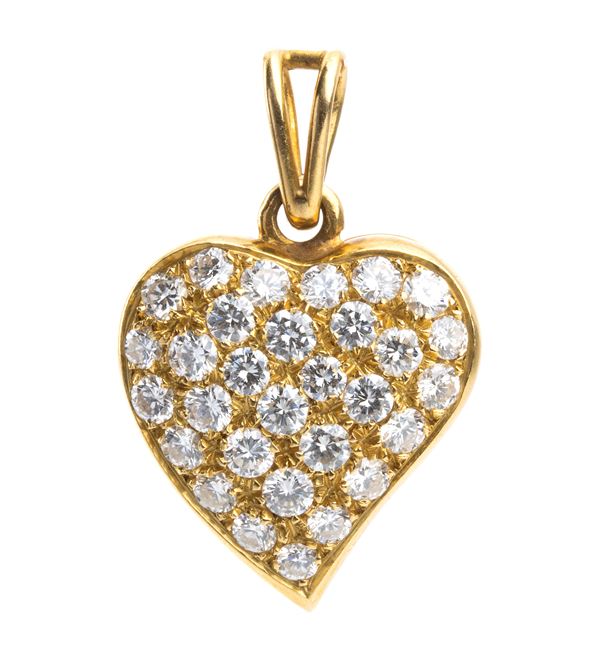 Gold heart shaped pendant with diamonds
