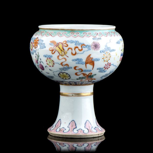 A POLYCHROME ENAMELLED PORCELAIN STEM CUP