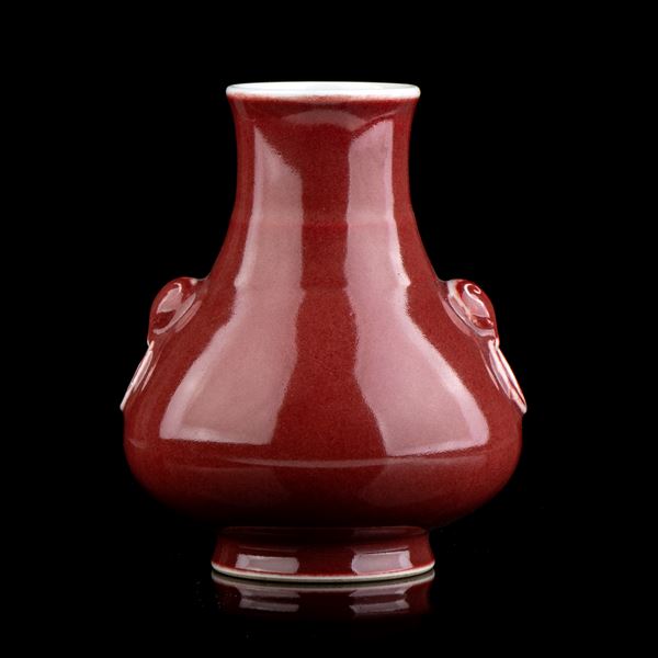 A RED GLAZED PORCELAIN VASE
