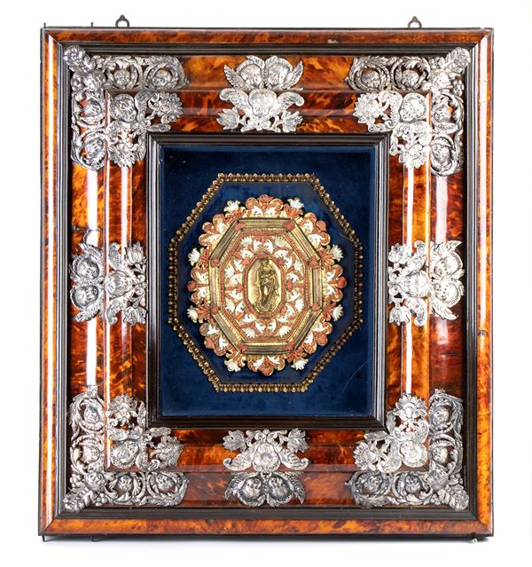 Tortoiseshell case with coral bedside