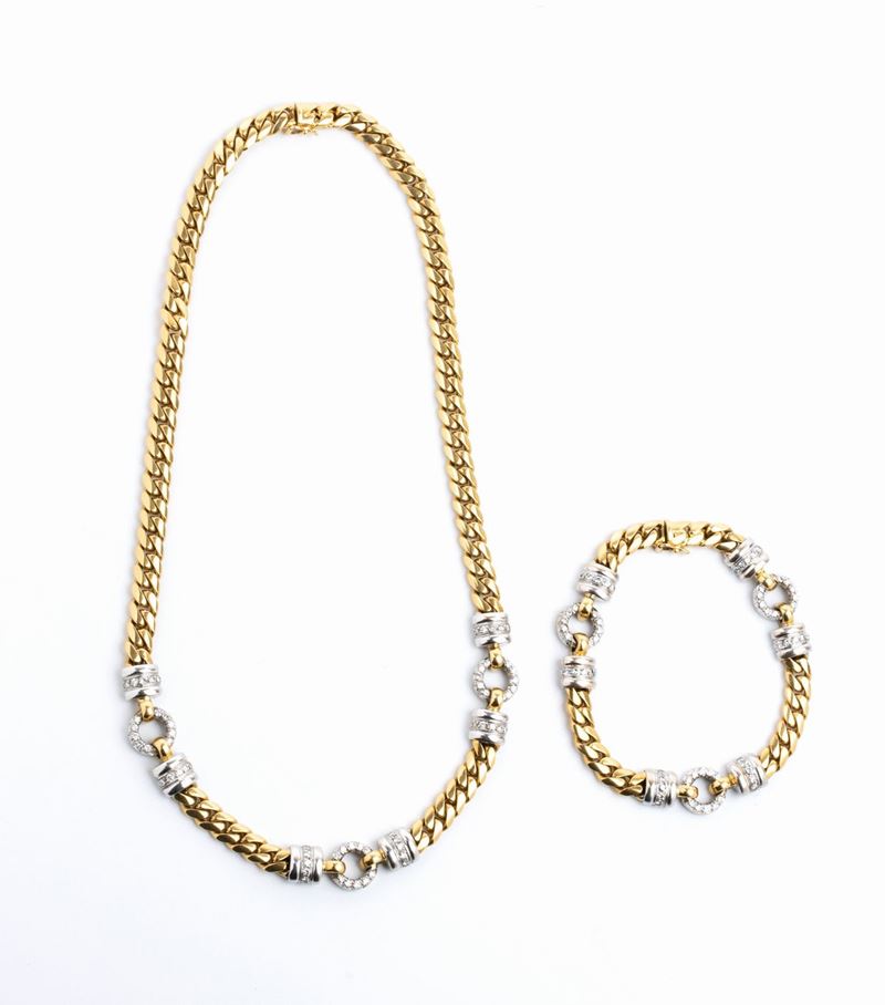 Demi parure composta da collana e bracciale in oro e diamanti