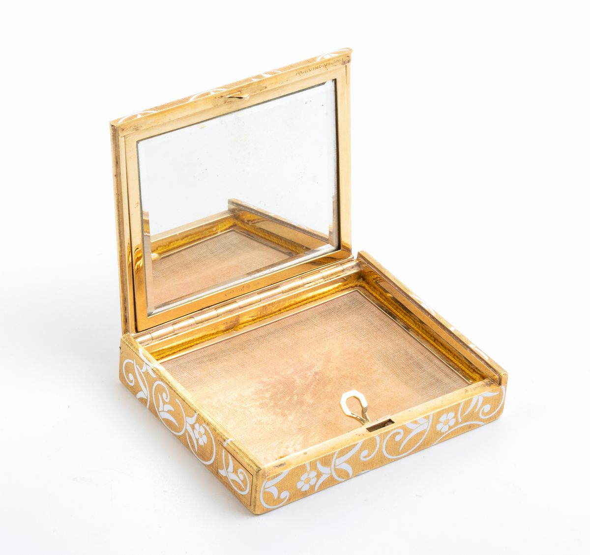 FARAONE: portacipria in oro con smalti bianchi e diamanti