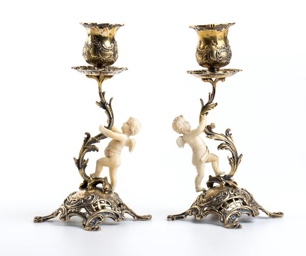 Coppia di candelieri in argento e avorio