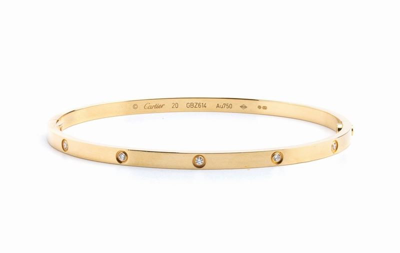 CARTIER, collezione Love: bracciale rigido in oro e diamanti