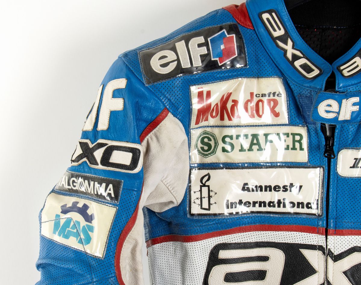 Motociclismo, Loris Capirossi , Tuta da Gara e Casco Autografati