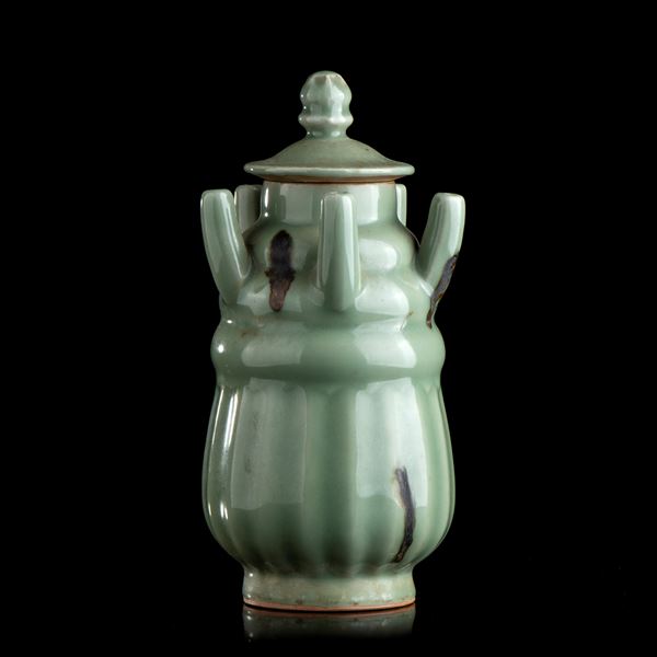A CÉLADON GLAZED CERAMIC URN AND LID