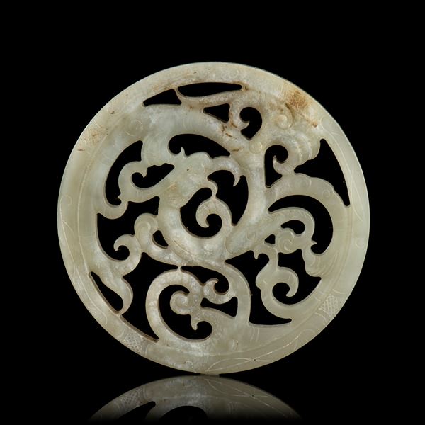 A PALE GREEN 'DRAGON' CIRCULAR PLAQUE 