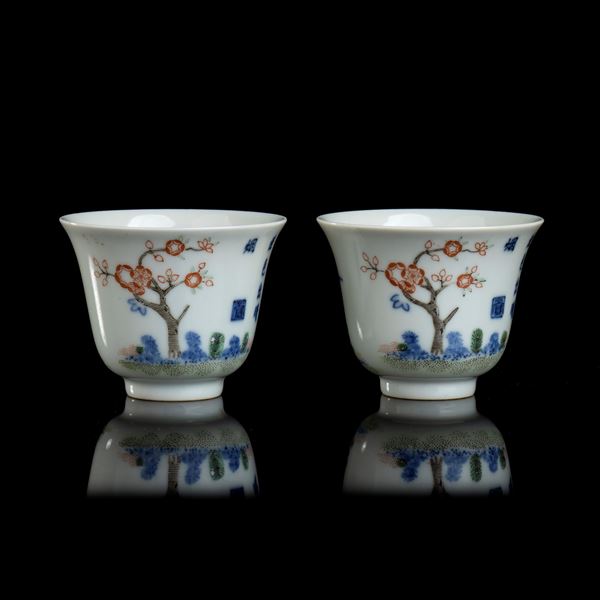 TWO POLYCHROME ENAMELLED PORCELAIN CUPS 