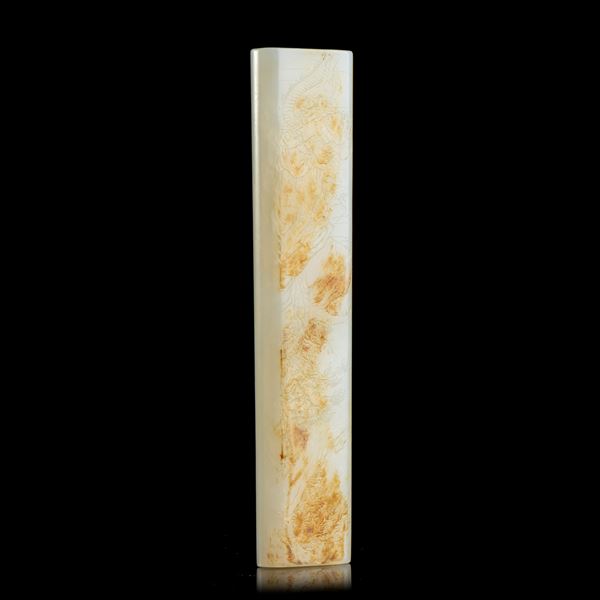 A WHITE AND RUSSET JADE PAPERWEIGHT