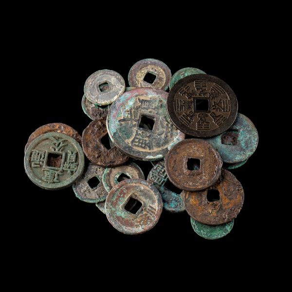 TWENTY-FOUR METAL COINS