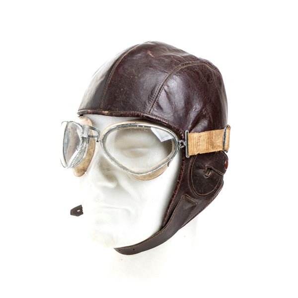 A PILOT'S HELMET WITH GOGGLES