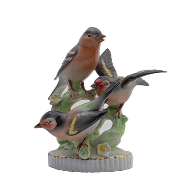 Group of three polychrome porcelain birds