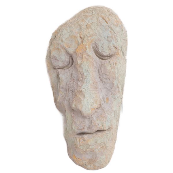 Face, sculpture in pink stone of Assisi