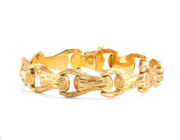 Bracciale in oro con maglie a forma di tronchetti