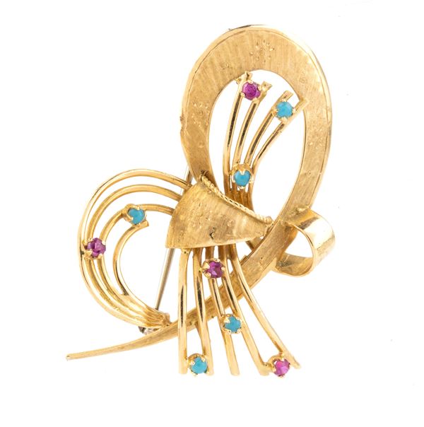 Gold bow shaped brooch