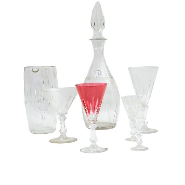 Set of red and white crystal glasses in six different sizes