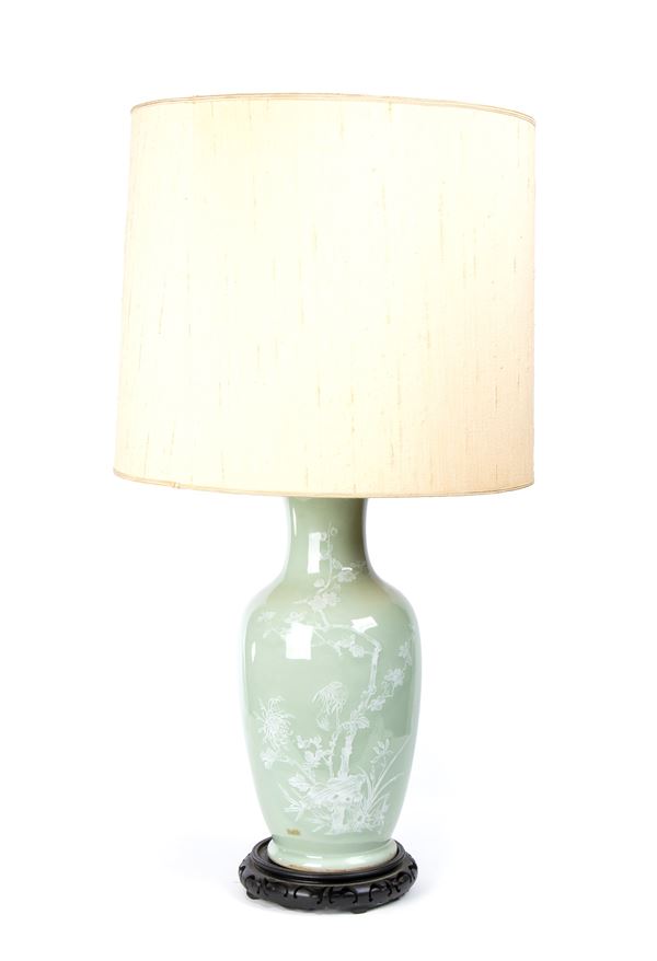 A CÉLADON GLAZED AND SLIP DECORATED PORCELAIN BALUSTER VASE MOUNTED AS A LAMP 