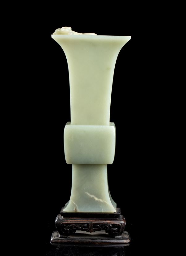 A PALE GREEN JADE GU VASE