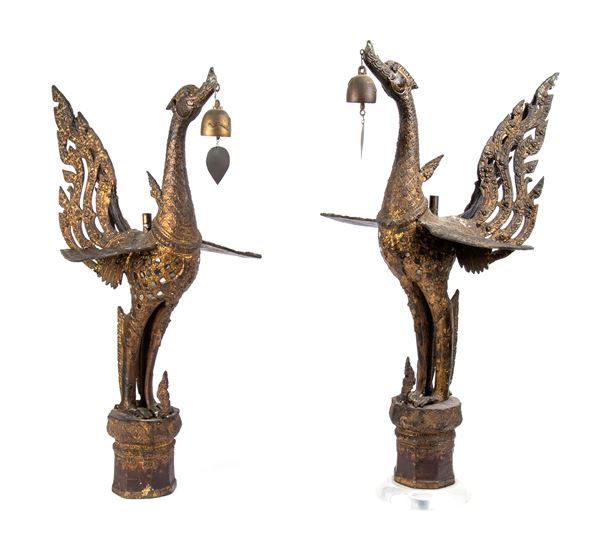 A PAIR OF CARVED WOOD AND GLASS INLAID MITHICAL GEESE