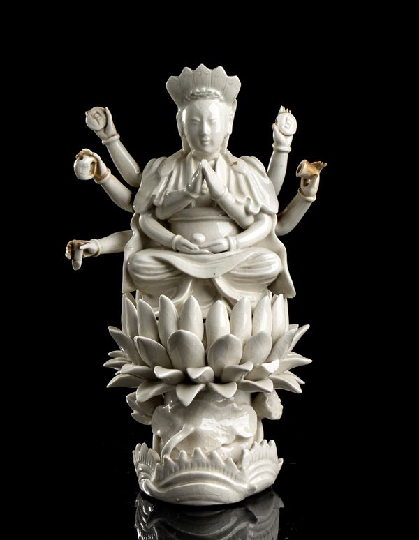 A 'BLANC DE CHINE' PORCELAIN FIGURE OF DOUMU