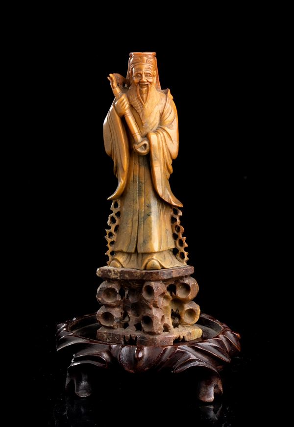 A SOAPSTONE DEITY