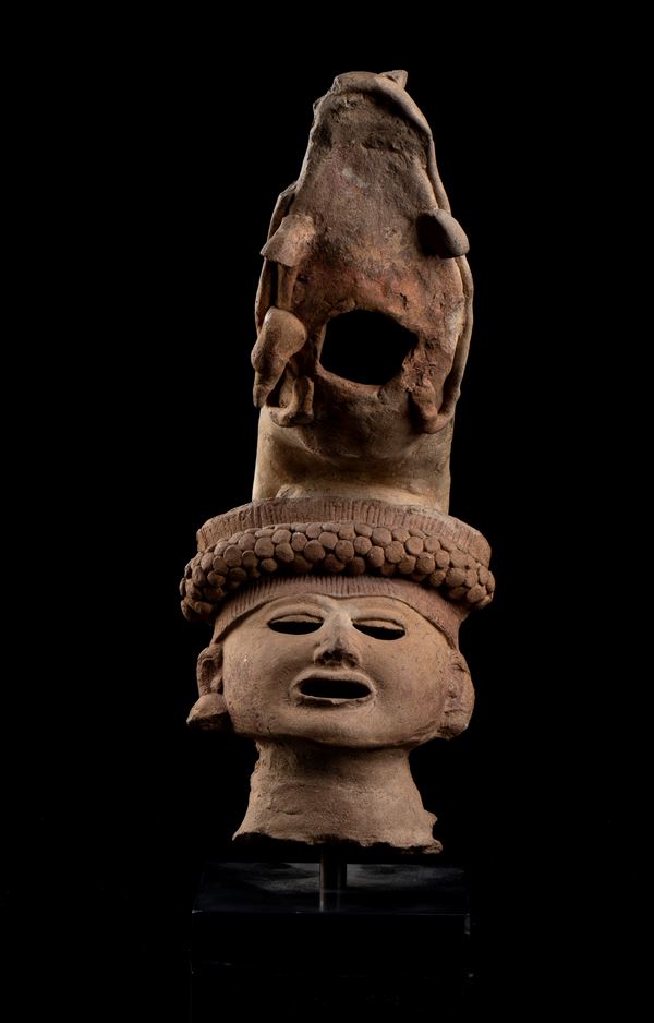 A CLAY WARRIOR HEAD WITH SNAKE HEADDRESS