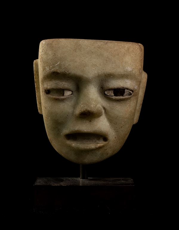 A RARE LIGHT GREEN ALABASTER MASK