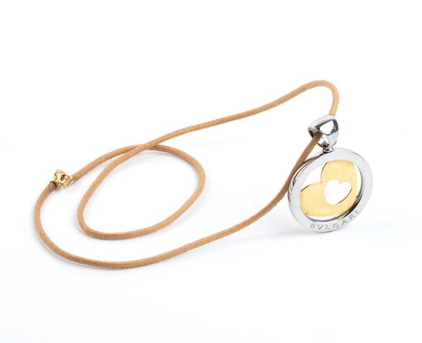 BULGARI: with a gold and steel pendant necklace