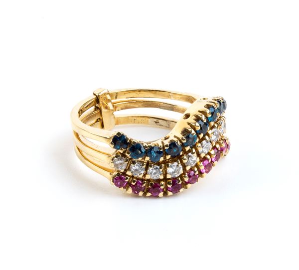 Tre anelli in oro con rubini, zaffiri e diamanti