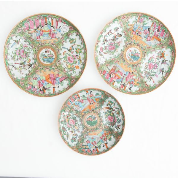 Lot of three polychrome porcelain plates, 