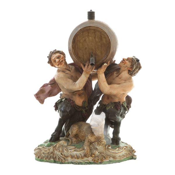 Satyrs with barrel and leopard, polychrome porcelain group,