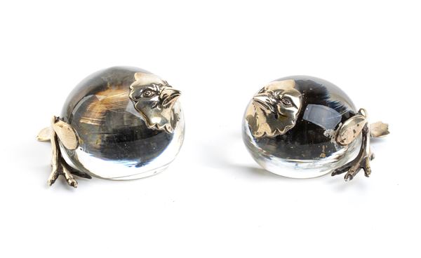 A pair of silver and glass birds