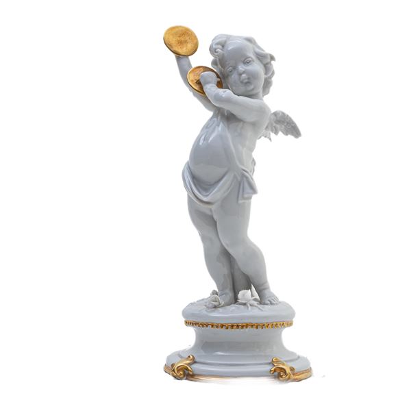 Putto in white porcelain with cymbals