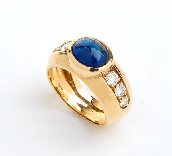 Blue sapphire diamond gold band ring 