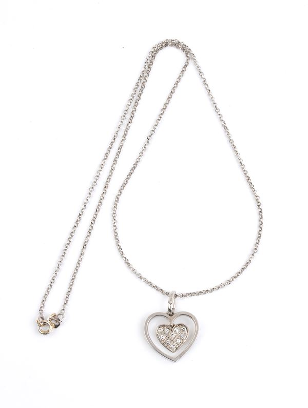 Gold necklace with a heart shaped gold diamond pendant 