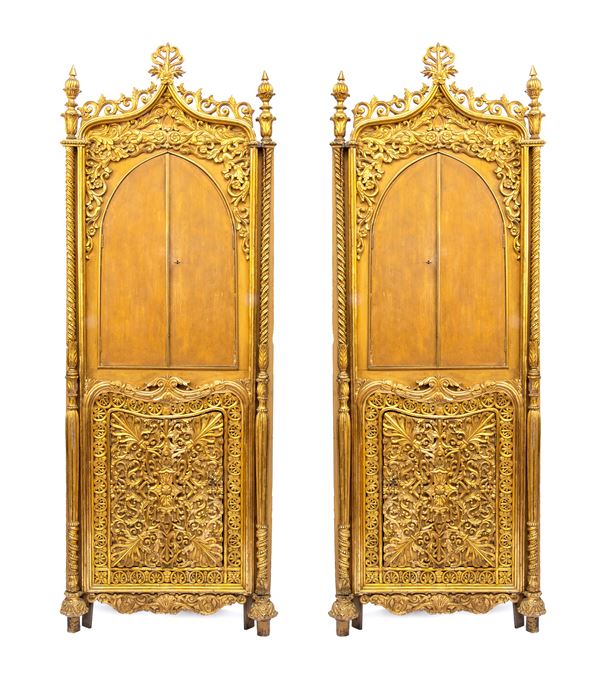 Pair of venete gilded corner cabinets 
