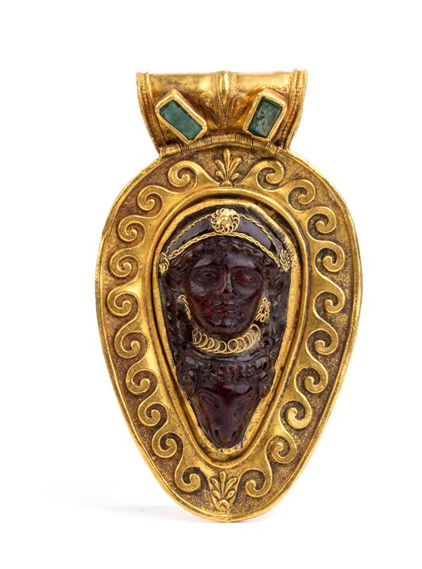 Gold archeological-style pendant with amber and emeralds