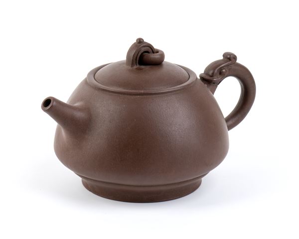 A YIXING CERAMIC TEAPOT