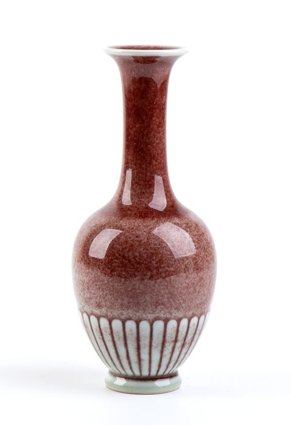 A RED GLAZED PORCELAIN BOTTLE VASE