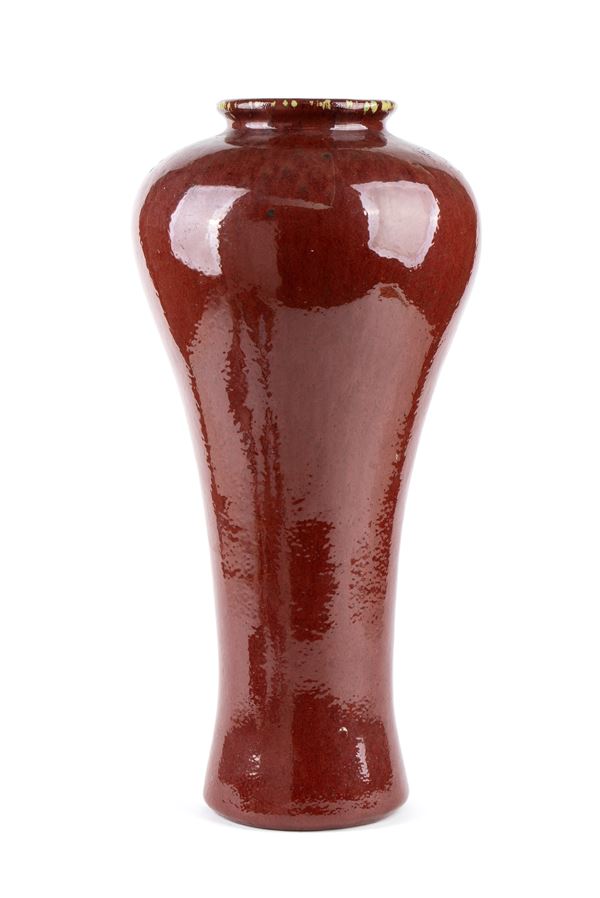 A 'SANG DE BOEUF' GLAZED PORCELAIN BALUSTER VASE