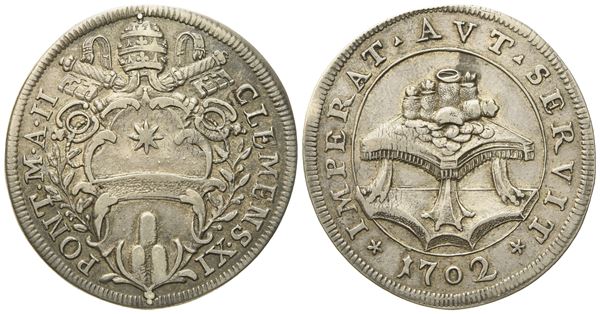 STATO PONTIFICIO. Roma. Clemente XI (1700 - 1721). Testone 1702 "Tavolo con monete". Ag (9,04 g; 32,2 mm)