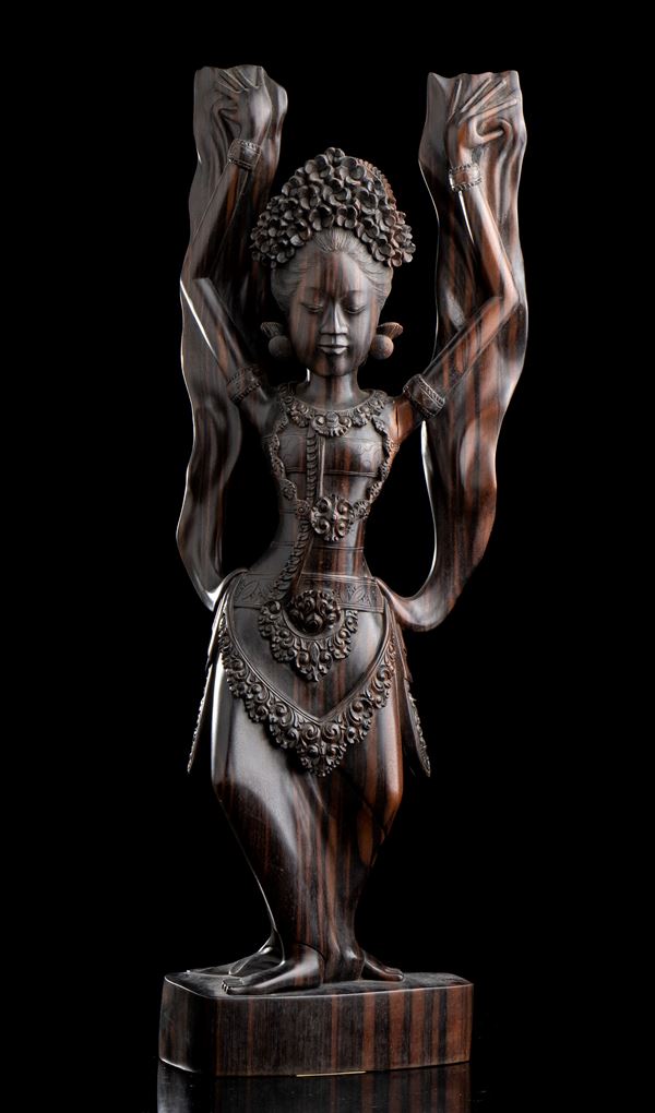 A WOOD SCULPTURE WITH A FEMALE FIGURE