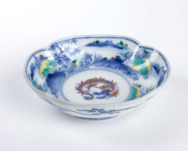 A POLYCHROME ENAMELLED PORCELAIN SHAPED BOWL