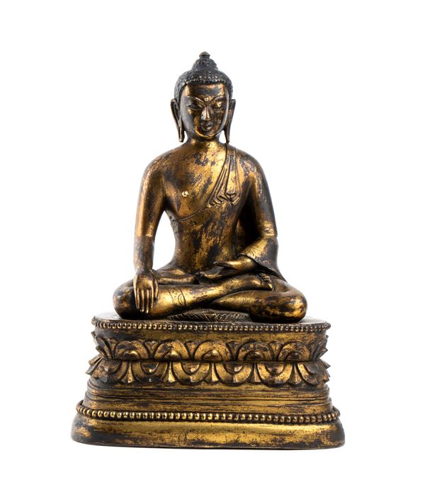 A GILT BRONZE BUDDHA 