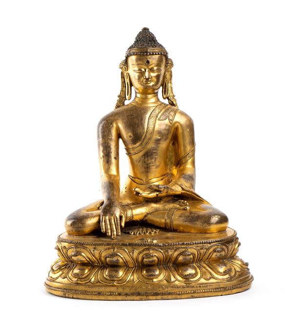 A GILT BRONZE BUDDHA 