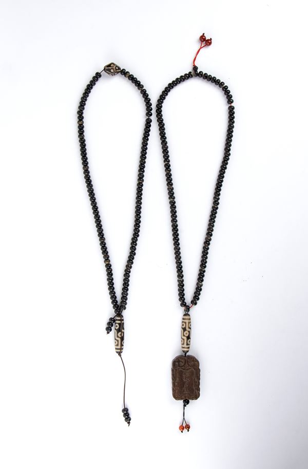 TWO HORN NECKLACES WITH THREE DZI AND A WOOD PENDANT